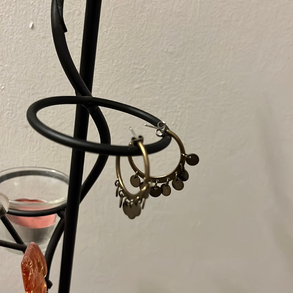 Brassy gold bangle hoops(not actual gold. Just referring to color)